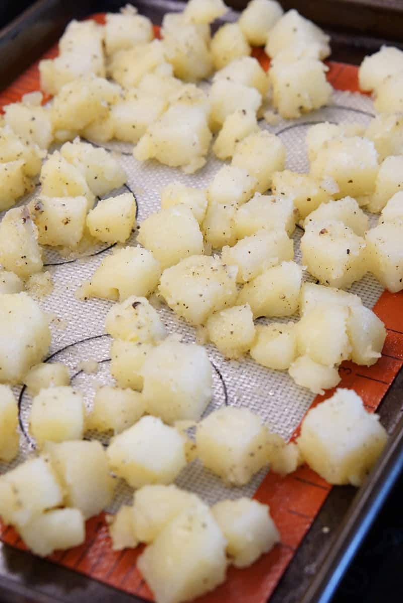 spread potatoes on baking sheet