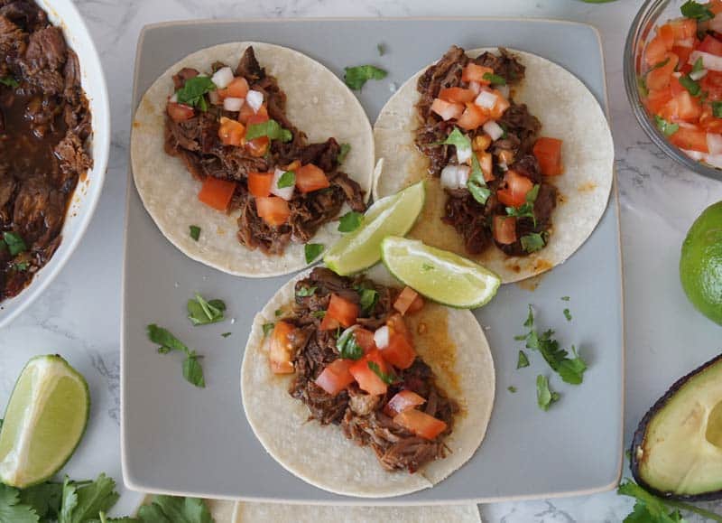 Three beef barbacoa tacos