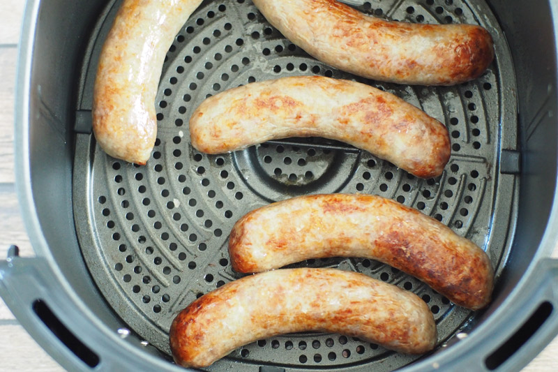 Cooked Brats in the Air Fryer Basket
