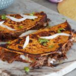 Birria tacos with consomme