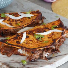 Birria tacos with consomme
