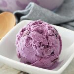A scoop of homemade blueberry ice cream