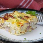 A slice of potato, ham and egg casserole