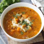 A bowl of butternut squash sausage soup