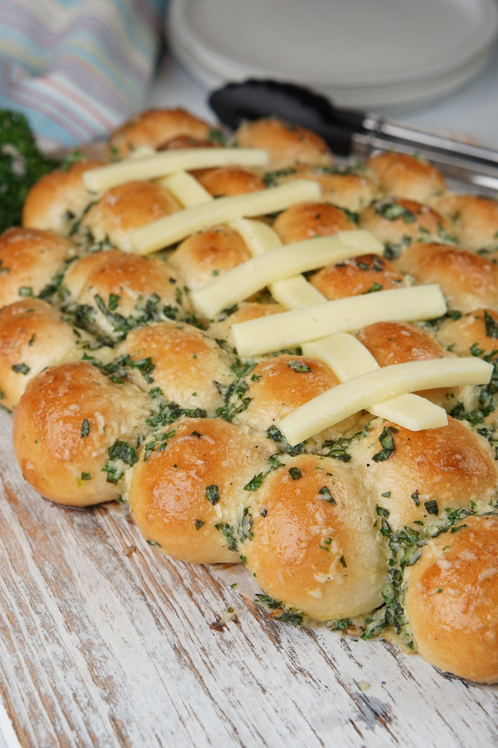 football shaped cheesy garlic bread