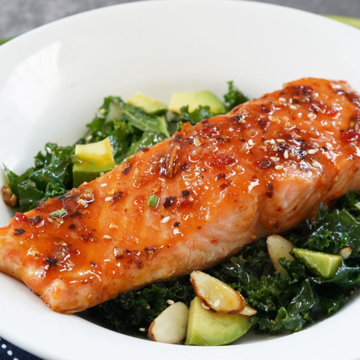 Chili crunch salmon with miso kale salad