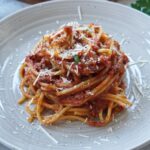 a pile of spaghetti on a plate.