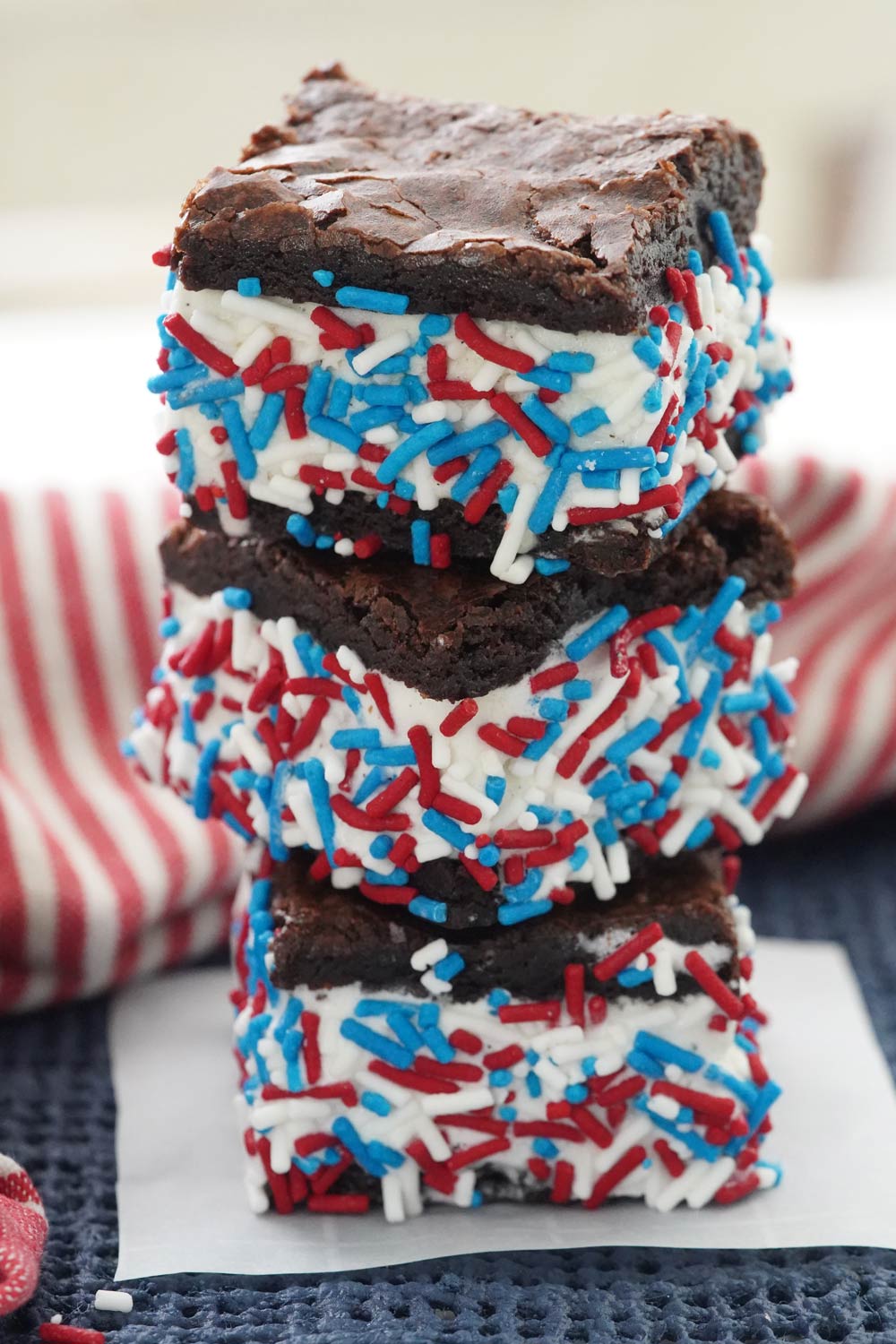 Festive 4th of July Brownie ice cream sandwiches rolled in red, white, and blue sprinkles