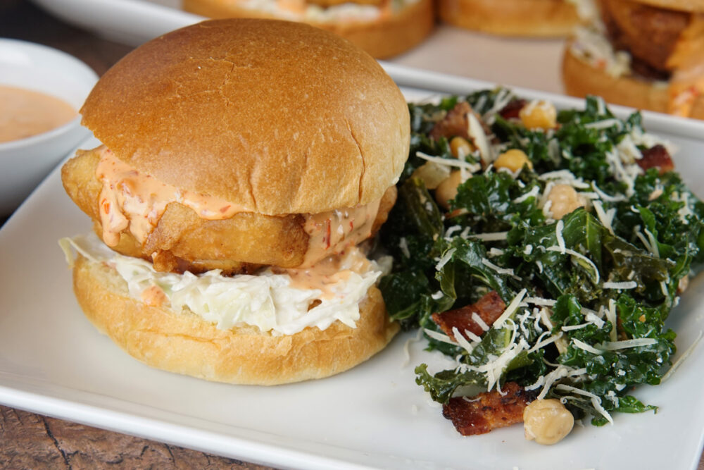 Fish burger with kale salad