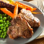 Lamb chops with peas and carrots