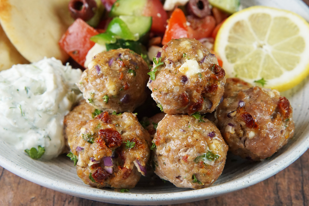 Mediterranean chicken meatballs with tzatziki and Greek salad