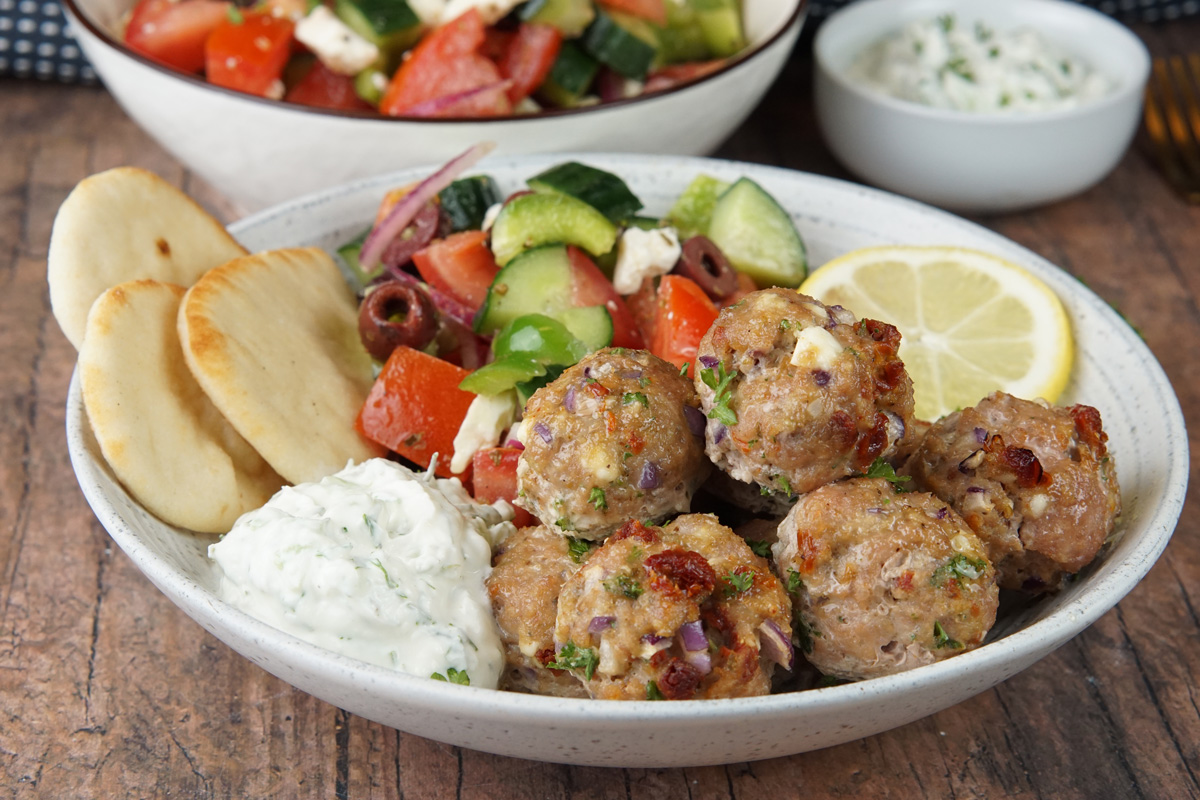 Mediterranean chicken meatballs with tzatziki and Greek salad