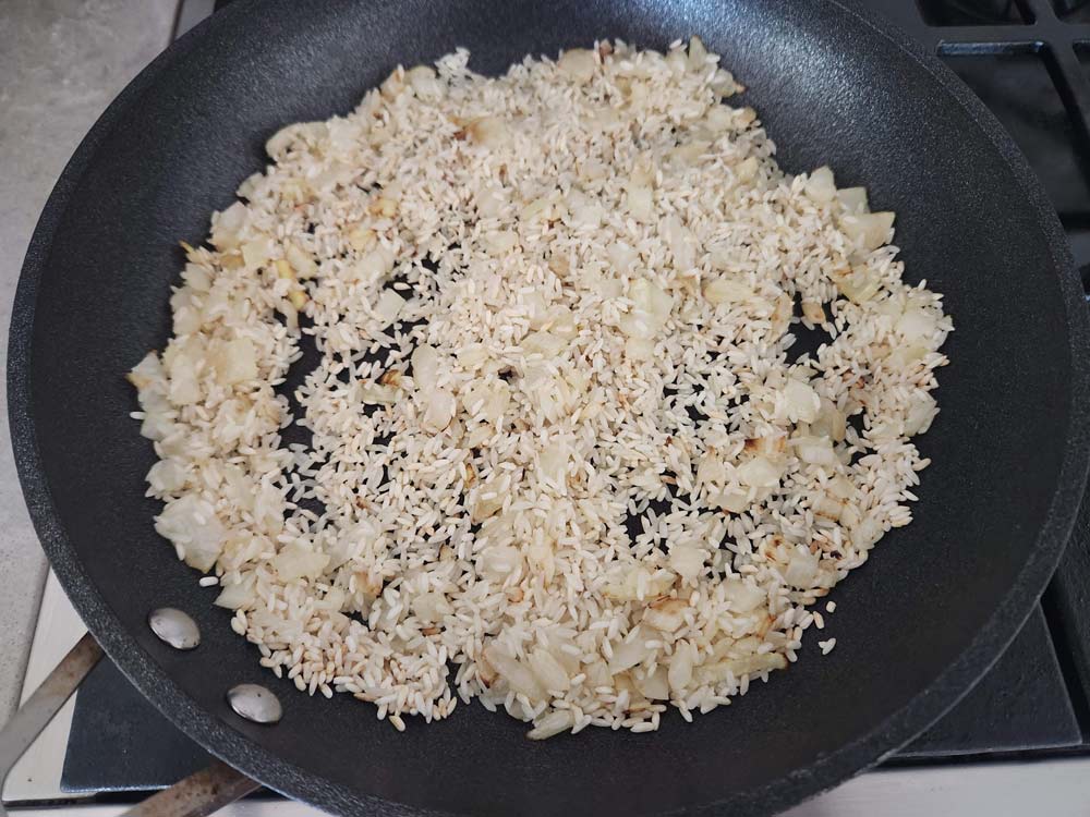 Cooking rice in a pan.
