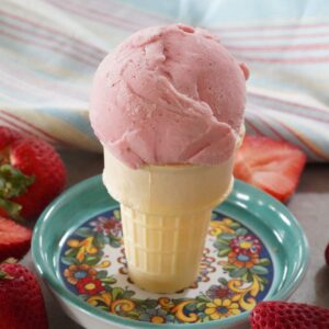 A strawberry ice cream cone