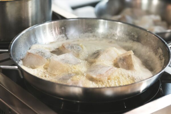 Fish frying in a pan