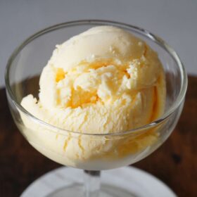 Orange creamsicle ice cream in a dish