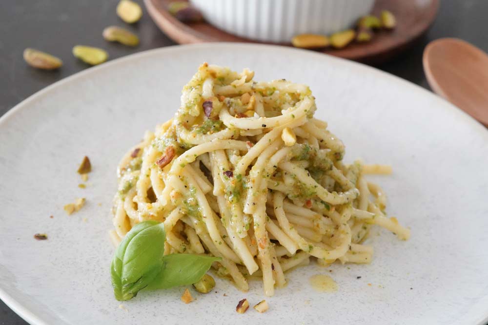 Pasta with pistachio pesto on a plate