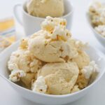 Popcorn ice cream in a bowl with popcorn on top