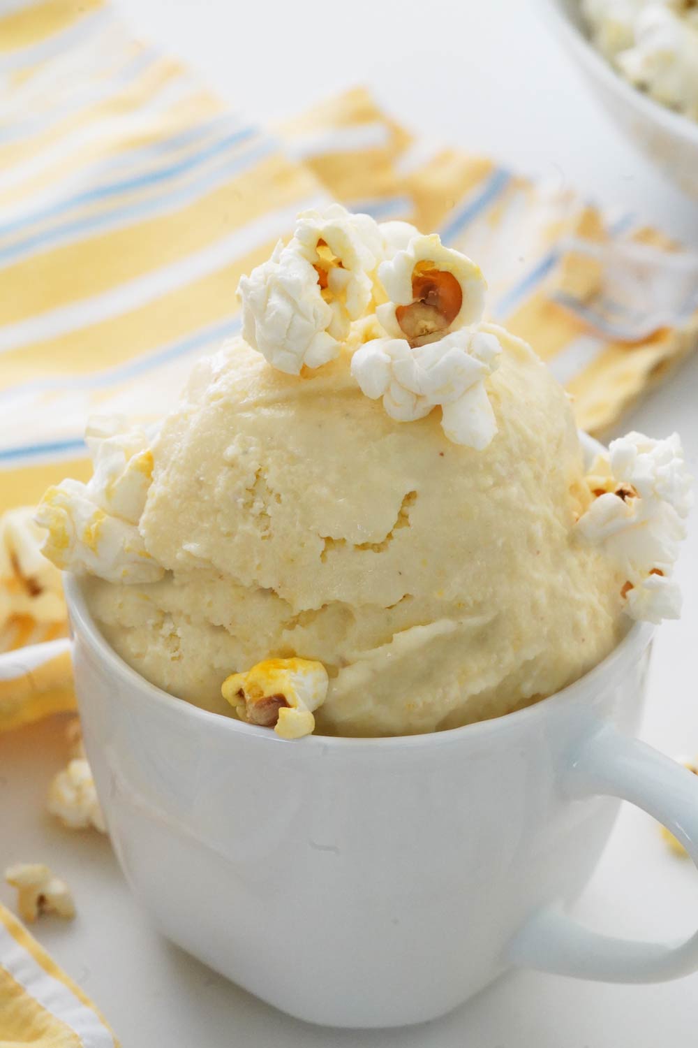 Popcorn ice cream in a bowl with popcorn on top