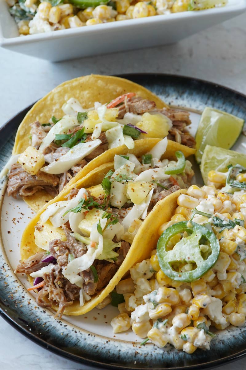 pulled pork tacos with mexican street corn salad