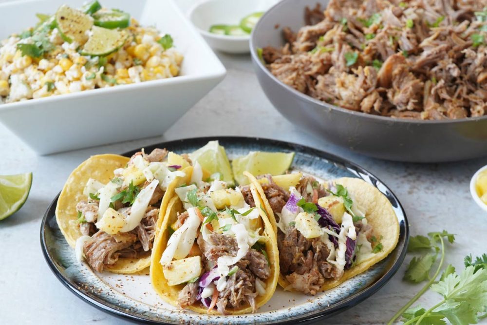 pulled pork tacos with mexican street corn salad