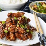 Sesame chicken and rice with smashed cucumber salad