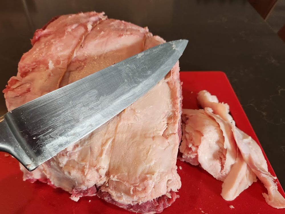 Cutting some fat off the roast