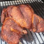 Spatchcock smoked chicken on the grill
