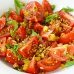summer tomatoes with Dukkah and green onions
