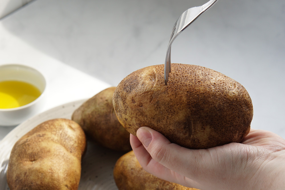 Poking holes in potatoes with a fork