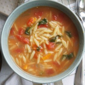A bowl of vegetable orzo soup